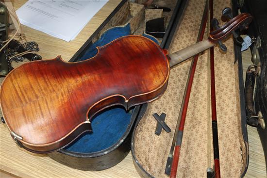 A German Strad style violin and a small violin and two bows